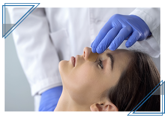 doctor holding patient's nose