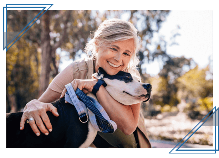 happy woman hugging dog