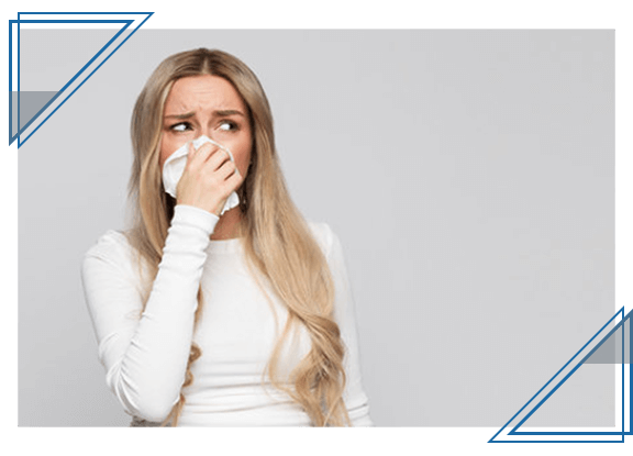 woman blowing nose